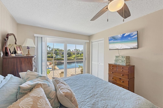 bedroom featuring a textured ceiling, access to exterior, a closet, and ceiling fan