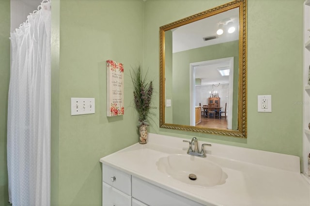 bathroom with visible vents and vanity