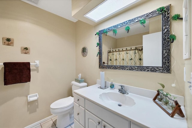 bathroom with vanity, tile patterned floors, curtained shower, and toilet