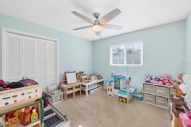 recreation room featuring carpet floors and ceiling fan