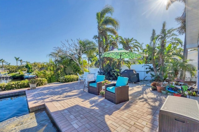 view of patio with fence and a fenced in pool