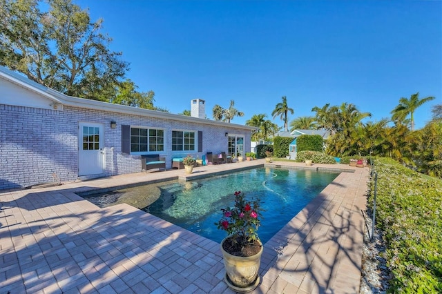 outdoor pool featuring a patio area