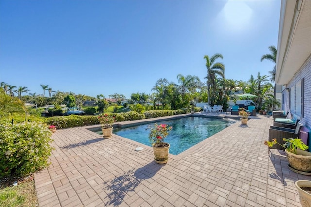 outdoor pool featuring a patio area