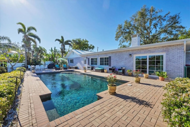 pool featuring a patio area