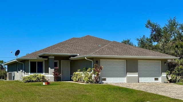 ranch-style house featuring stucco siding, an attached garage, roof with shingles, and a front yard