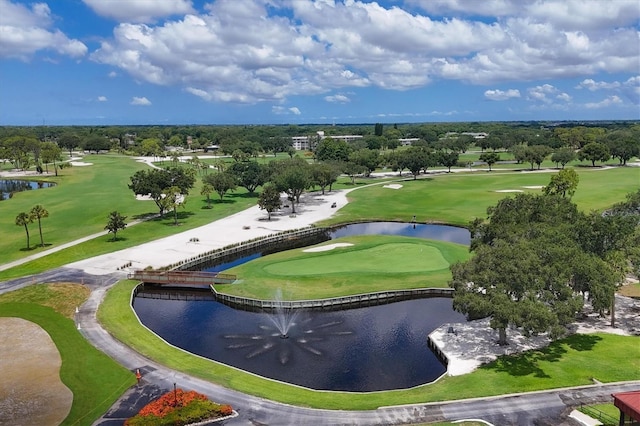 aerial view with view of golf course and a water view