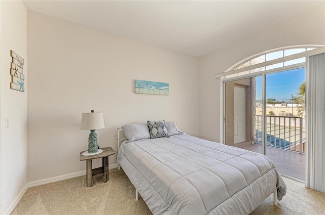 bedroom with baseboards, light colored carpet, and access to exterior