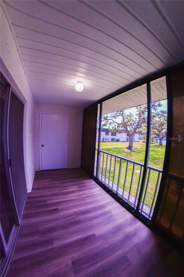 exterior space featuring expansive windows and wood finished floors