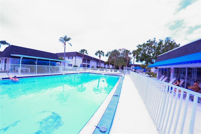 community pool featuring fence