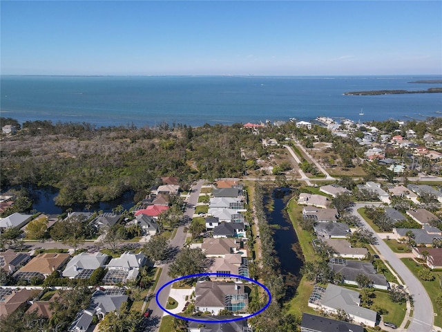 bird's eye view featuring a water view and a residential view