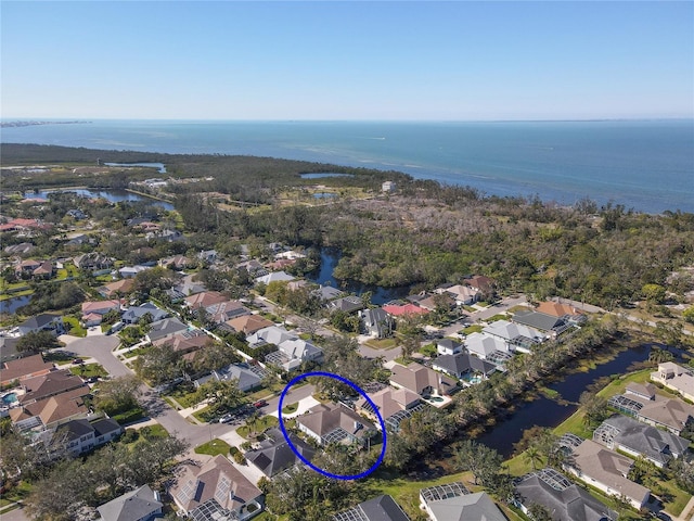 bird's eye view with a water view and a residential view