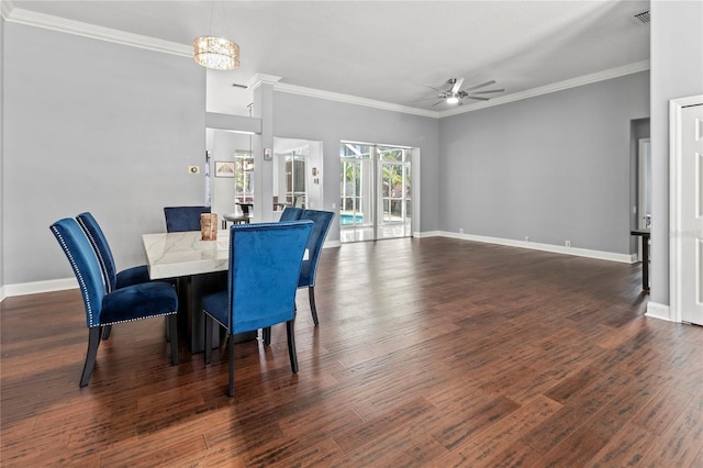 dining area with ornamental molding, wood finished floors, and baseboards