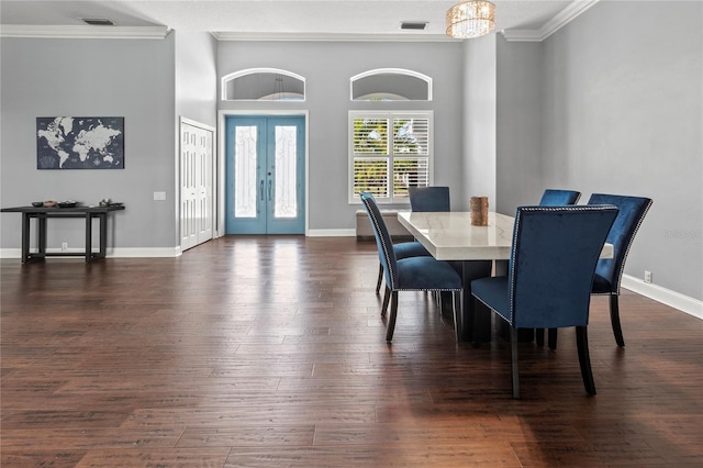 dining space with dark wood-style floors, french doors, crown molding, and baseboards