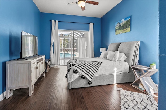 bedroom featuring dark wood-type flooring, access to outside, baseboards, and a ceiling fan