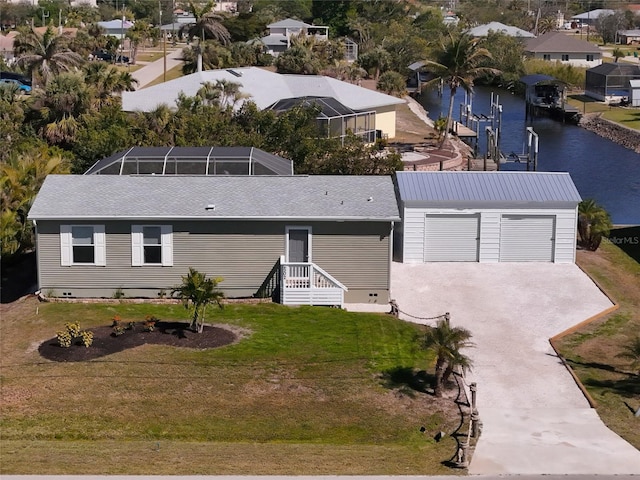 birds eye view of property featuring a water view and a residential view