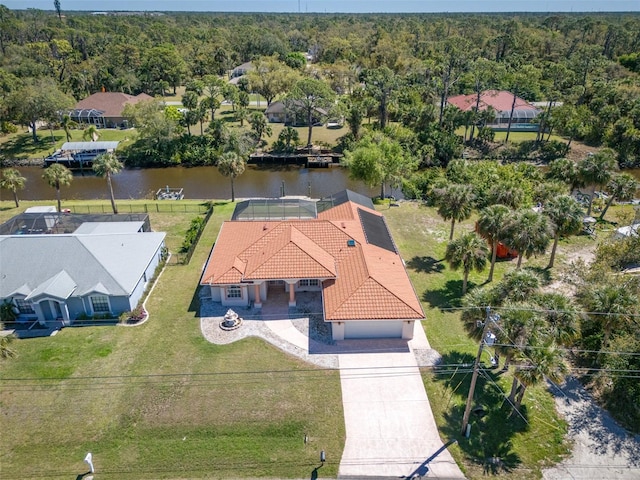 bird's eye view featuring a wooded view and a water view