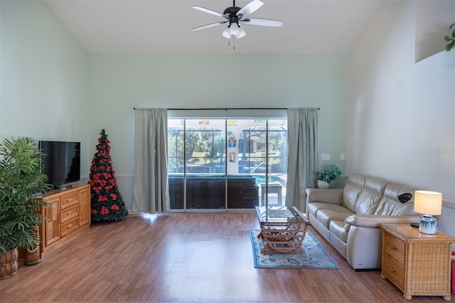 living area featuring wood finished floors and a ceiling fan