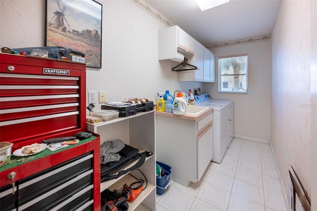 laundry area featuring cabinet space and separate washer and dryer