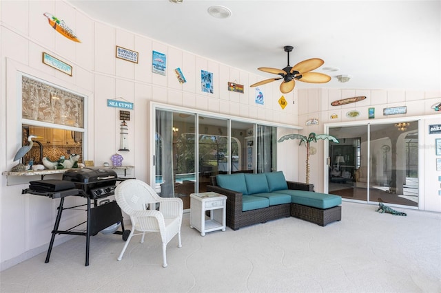 view of patio featuring grilling area, an outdoor hangout area, and a ceiling fan