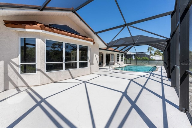 view of swimming pool featuring a patio, a fenced in pool, and a lanai