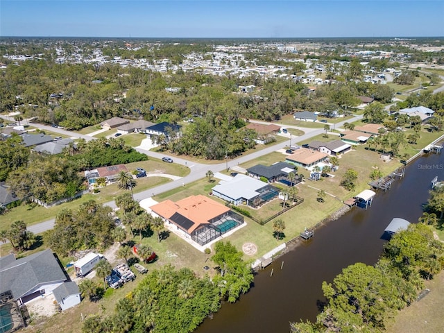 aerial view with a residential view and a water view