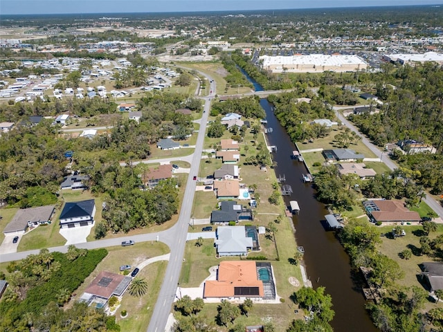 bird's eye view featuring a residential view and a water view