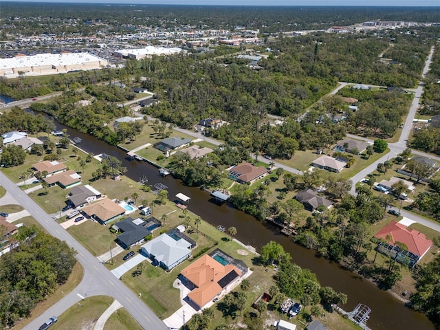 drone / aerial view with a residential view and a water view