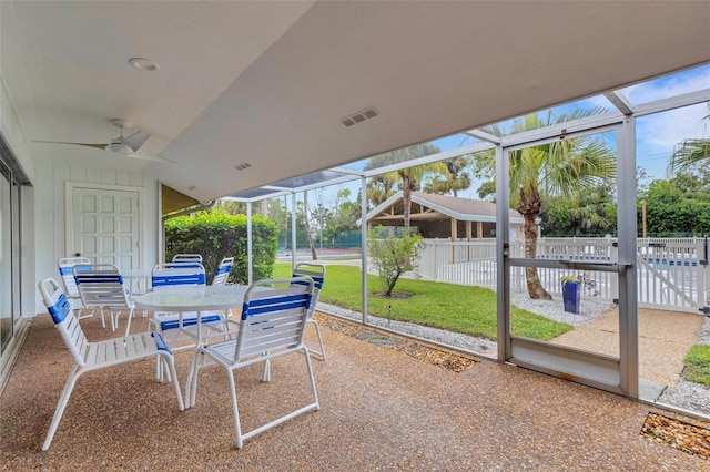 sunroom / solarium featuring a ceiling fan and visible vents