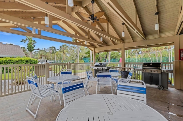 view of patio with area for grilling and outdoor dining area