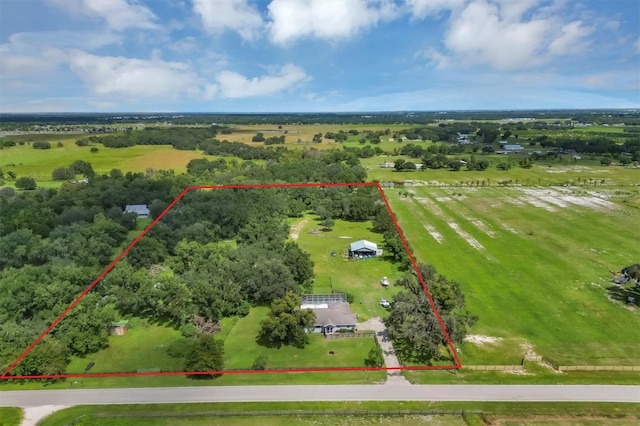 birds eye view of property featuring a rural view