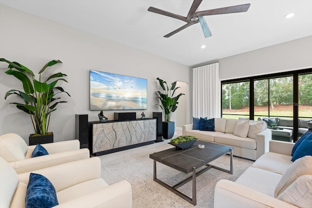 living area with recessed lighting, wood finished floors, and ceiling fan