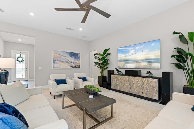 living room with recessed lighting, visible vents, baseboards, and a ceiling fan