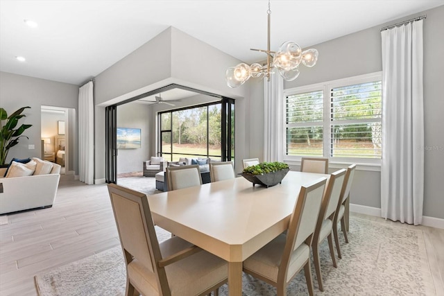 dining space with an inviting chandelier, recessed lighting, baseboards, and light wood finished floors