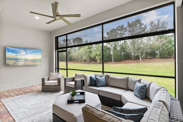 sunroom with ceiling fan