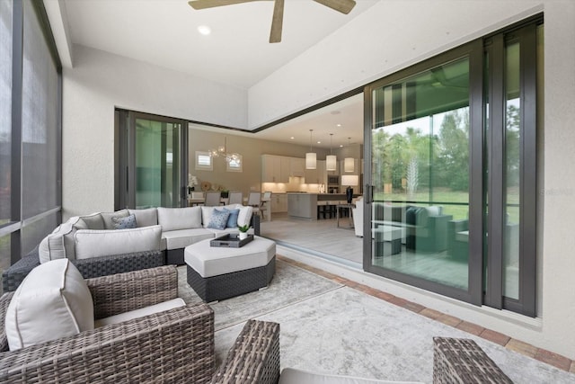 exterior space featuring ceiling fan with notable chandelier