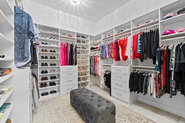 walk in closet featuring light tile patterned floors