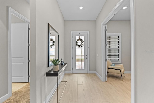 entrance foyer with recessed lighting, baseboards, and light wood-type flooring