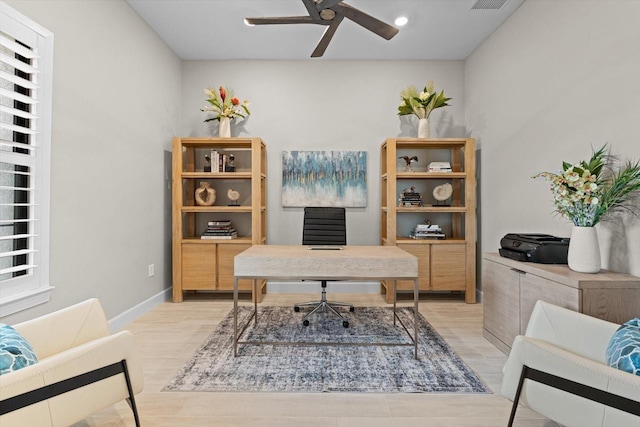 office space with baseboards, visible vents, recessed lighting, ceiling fan, and light wood-type flooring