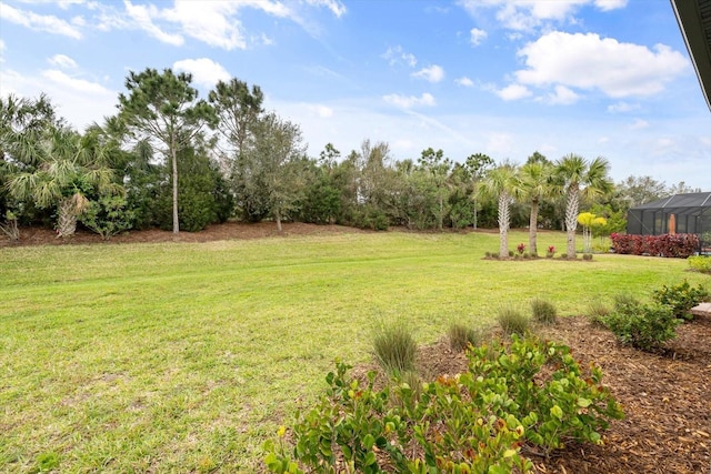 view of yard featuring glass enclosure