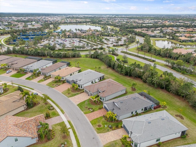 bird's eye view featuring a residential view and a water view