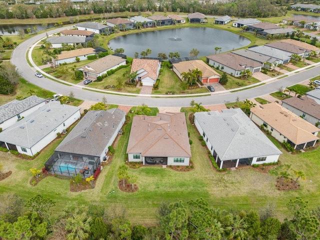 aerial view with a residential view and a water view