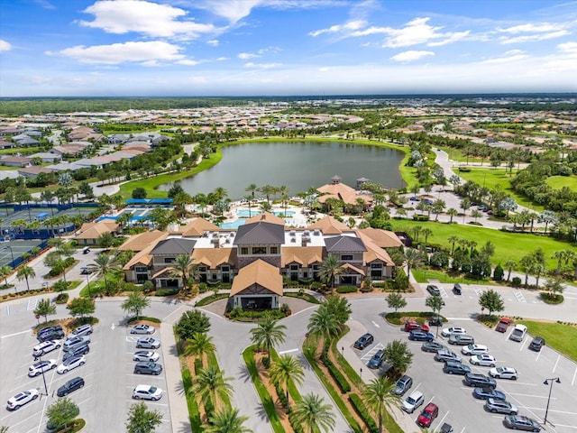 birds eye view of property with a water view