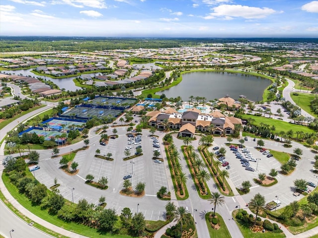 drone / aerial view with a residential view and a water view