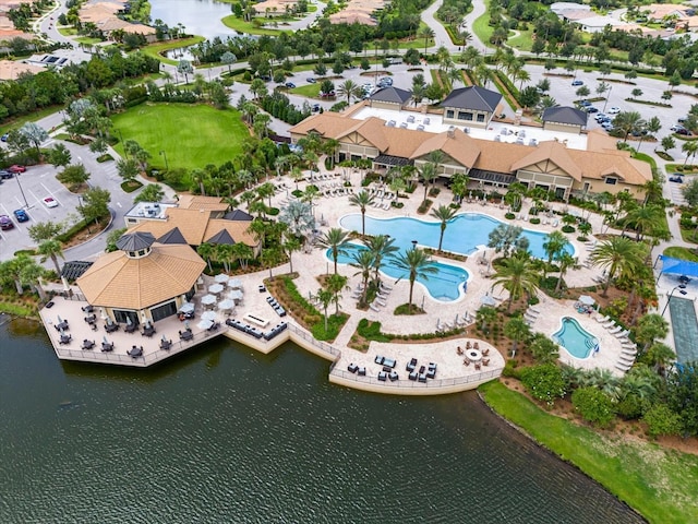 birds eye view of property with a residential view and a water view