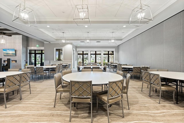 dining space with a chandelier, a decorative wall, recessed lighting, and crown molding