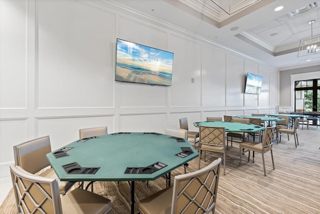 game room with visible vents, recessed lighting, ornamental molding, a raised ceiling, and a decorative wall