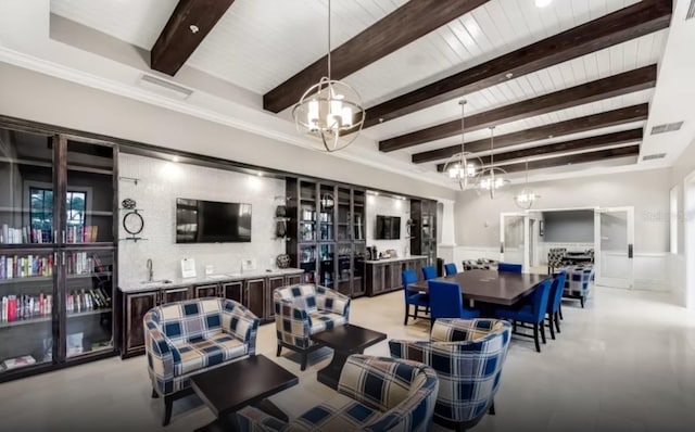 dining room with beamed ceiling, an inviting chandelier, wainscoting, and a decorative wall