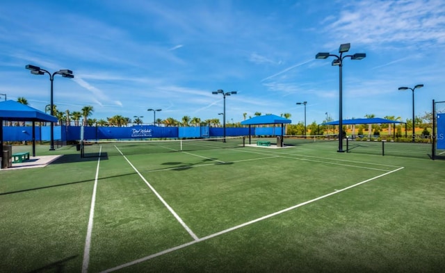 view of sport court with fence