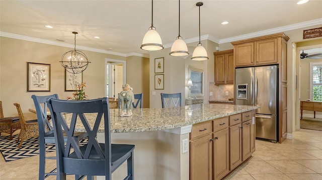 kitchen featuring ornamental molding, light stone countertops, and stainless steel fridge with ice dispenser