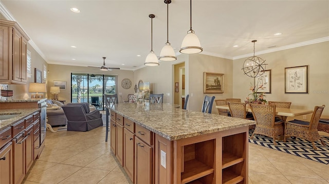 kitchen with light stone countertops, ornamental molding, and light tile patterned flooring